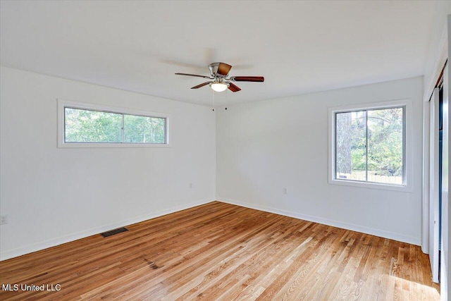 unfurnished room featuring light hardwood / wood-style floors and ceiling fan