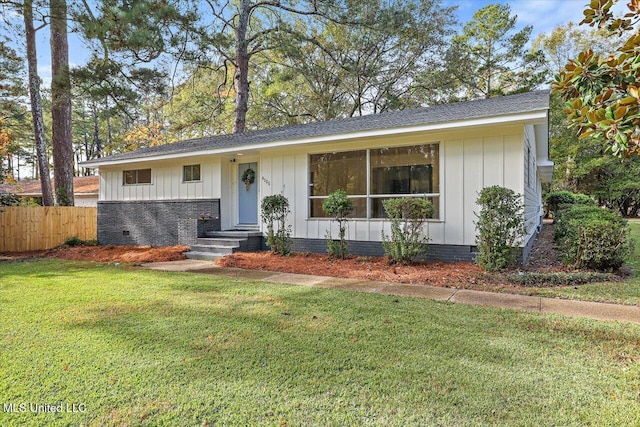 ranch-style home with a front lawn