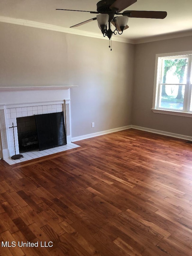 214 Evelyn St, Senatobia, MS 38668 - unfurnished living room with ornamental molding, a fireplace, wood finished floors, ceiling fan, and baseboards