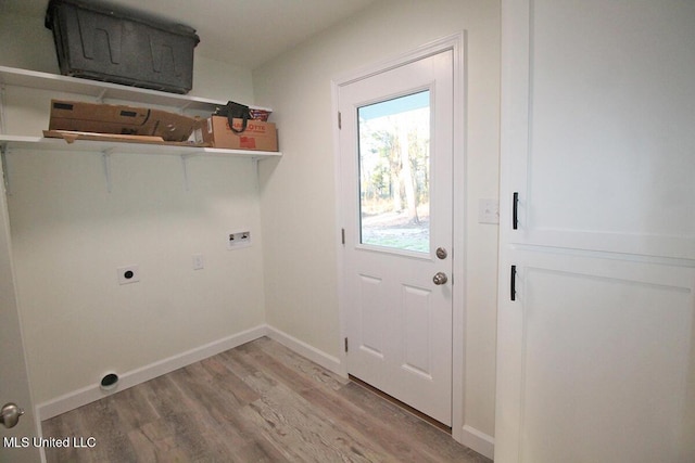 clothes washing area with hookup for an electric dryer, light hardwood / wood-style floors, and hookup for a washing machine