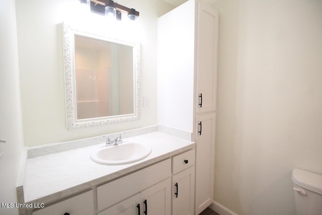 bathroom with vanity and toilet