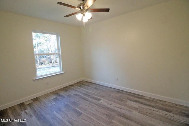 spare room featuring ceiling fan and wood-type flooring