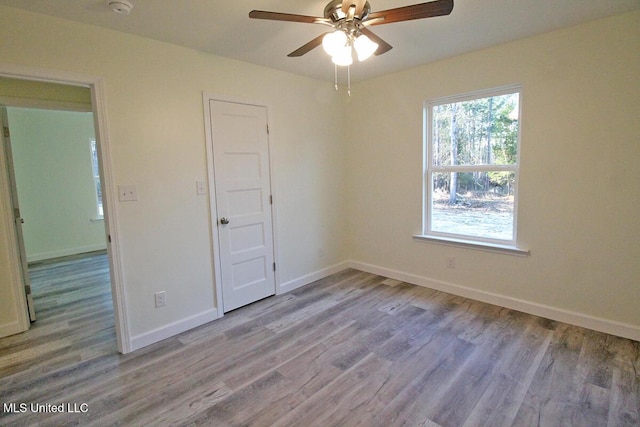 unfurnished bedroom featuring light wood-type flooring and ceiling fan