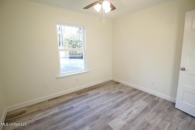 unfurnished room featuring light hardwood / wood-style flooring and ceiling fan