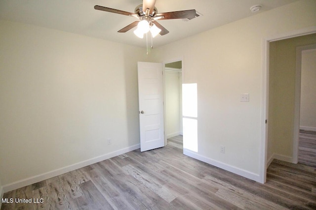 unfurnished bedroom featuring light hardwood / wood-style flooring and ceiling fan