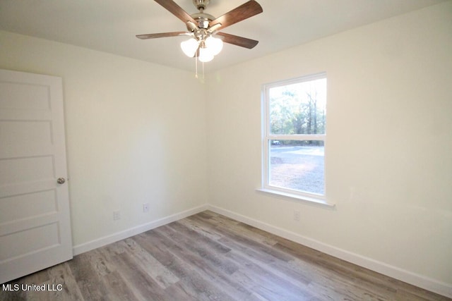 spare room with ceiling fan and light hardwood / wood-style floors