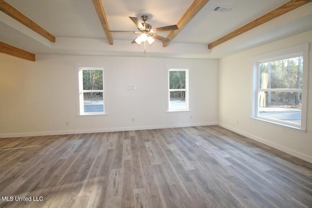 spare room with ceiling fan and wood-type flooring