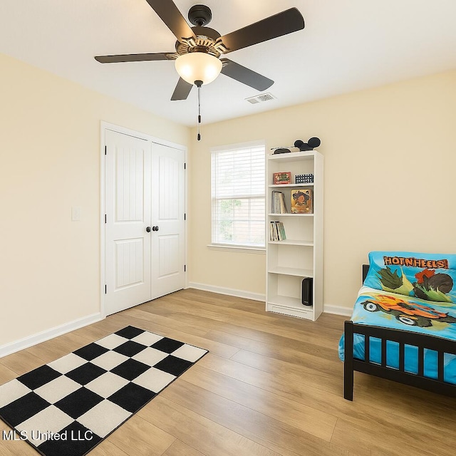 1177 Chestnut Dr, Southaven, MS 38671 - unfurnished bedroom featuring light wood finished floors, ceiling fan, and a closet