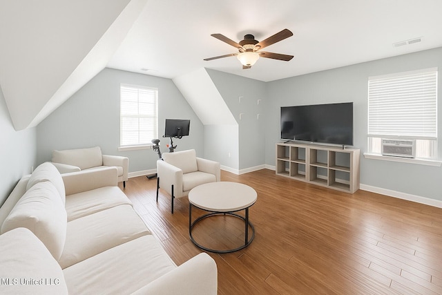 1177 Chestnut Dr, Southaven, MS 38671 - living room featuring cooling unit, ceiling fan, wood finished floors, and vaulted ceiling
