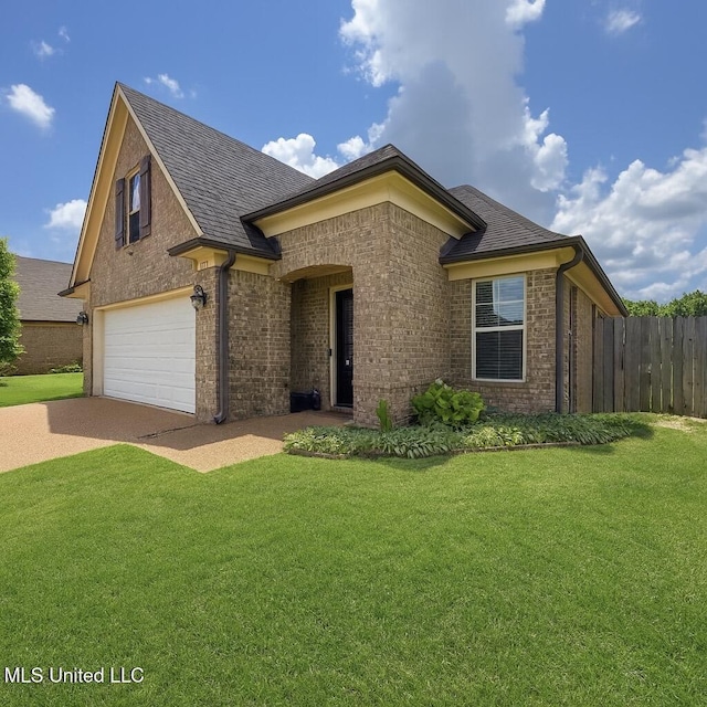 1177 Chestnut Dr, Southaven, MS 38671 - view of front of house featuring concrete driveway, an attached garage, brick siding, and roof with shingles