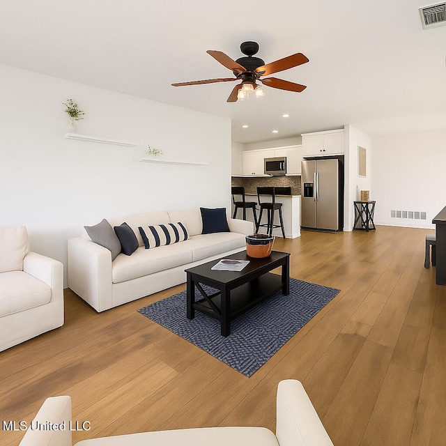 1177 Chestnut Dr, Southaven, MS 38671 - living room with a ceiling fan, recessed lighting, and light wood-type flooring