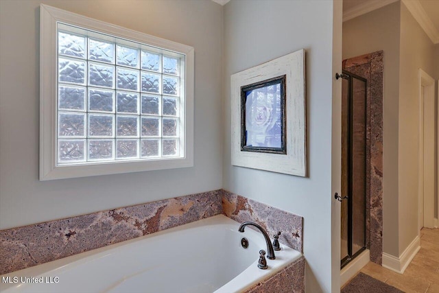 full bathroom featuring a shower stall and a garden tub