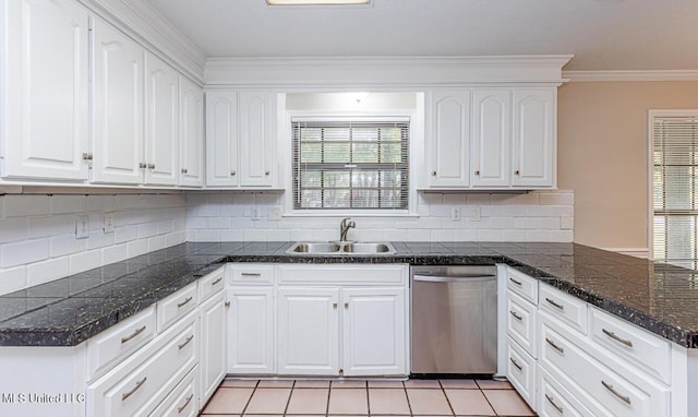 kitchen with a sink, stainless steel dishwasher, a peninsula, and white cabinetry
