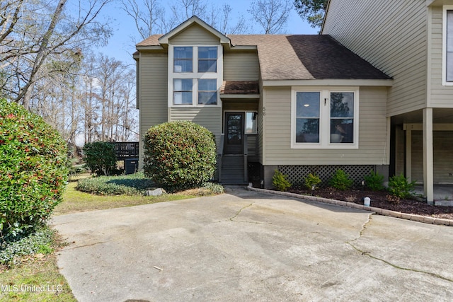 view of front of house with roof with shingles