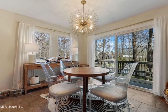 dining area featuring a notable chandelier