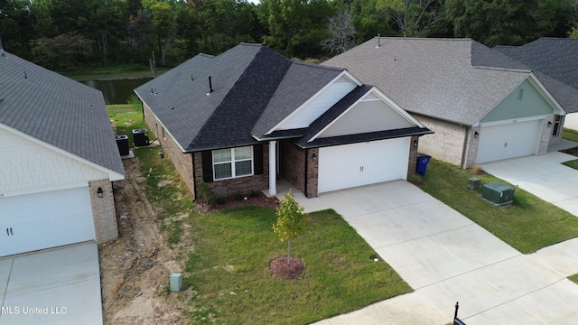 view of front of property with a garage and a front lawn