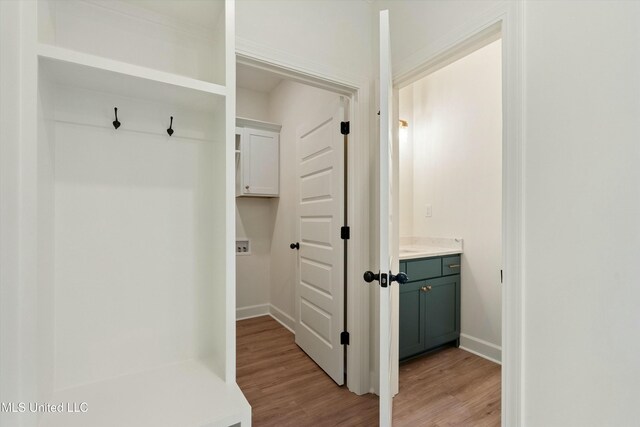 mudroom with light hardwood / wood-style flooring