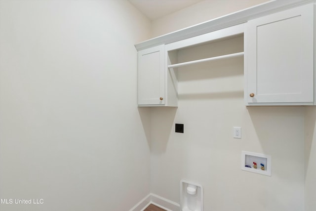 washroom with cabinets, hookup for a washing machine, and electric dryer hookup