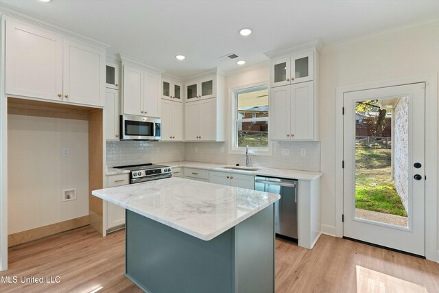 kitchen featuring white cabinetry, sink, and appliances with stainless steel finishes