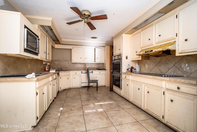 kitchen with multiple ovens, built in microwave, dishwasher, under cabinet range hood, and black electric cooktop