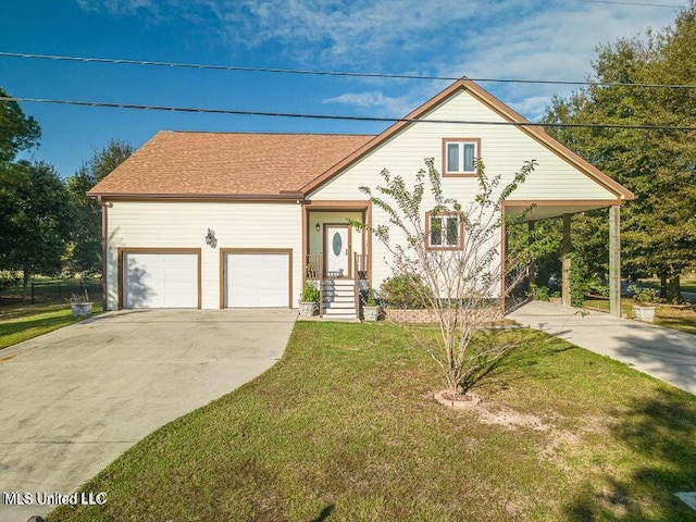 13 Chantilly Ter, Bay Saint Louis, MS 39520 - view of front of house featuring driveway, a front lawn, and an attached garage