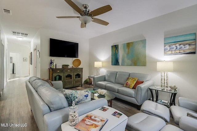 13 Chantilly Ter, Bay Saint Louis, MS 39520 - living room featuring wood finished floors and a ceiling fan