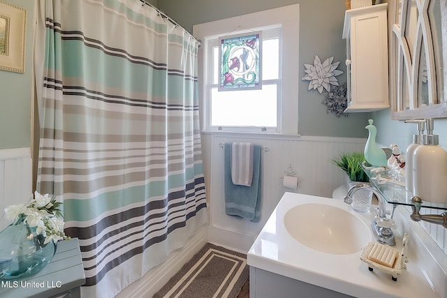 bathroom featuring vanity and a shower with curtain