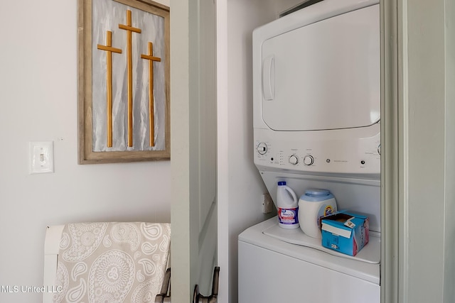 washroom with stacked washer and clothes dryer