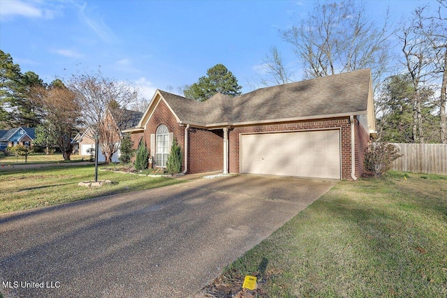 single story home with a garage, driveway, a front lawn, and brick siding