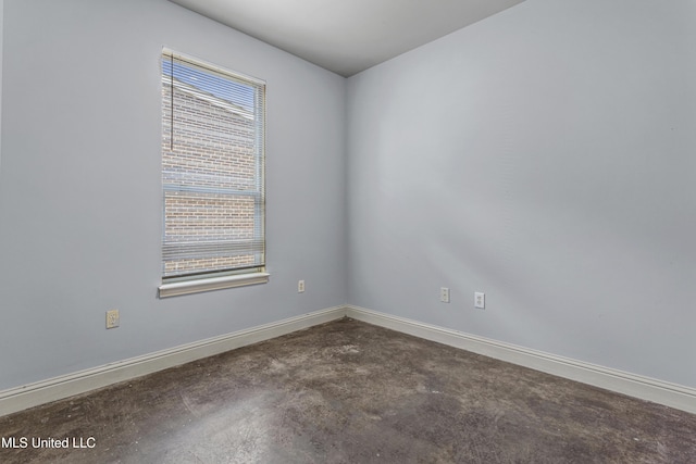 2948 Magnolia Ct, Gulfport, MS 39507 - empty room with healthy amount of natural light, baseboards, and concrete floors