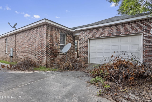 2948 Magnolia Ct, Gulfport, MS 39507 - view of property exterior with brick siding, concrete driveway, and an attached garage