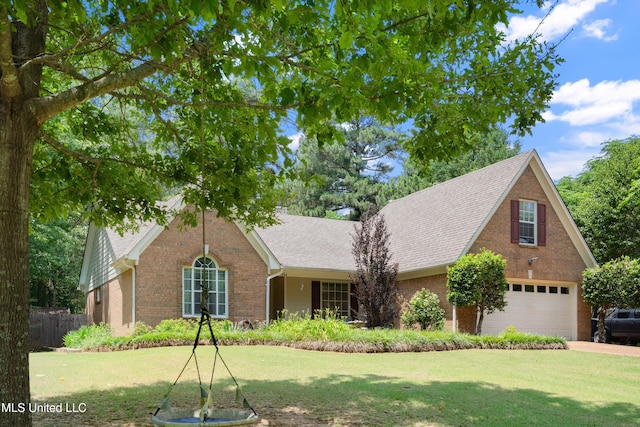 9884 Victor Dr, Olive Branch, MS 38654 - traditional home featuring brick siding, roof with shingles, an attached garage, and driveway