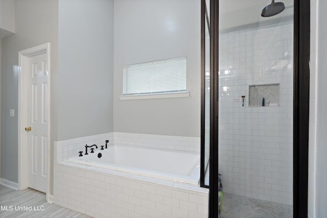 9884 Victor Dr, Olive Branch, MS 38654 - bathroom with a stall shower and a bath