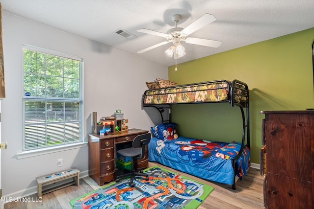 9884 Victor Dr, Olive Branch, MS 38654 - bedroom with wood finished floors, a ceiling fan, and baseboards