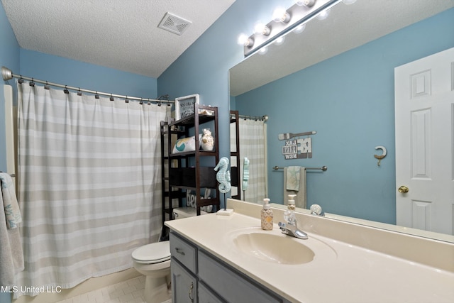 9884 Victor Dr, Olive Branch, MS 38654 - bathroom with vanity, toilet, a textured ceiling, and a shower with curtain