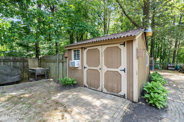 9884 Victor Dr, Olive Branch, MS 38654 - view of shed featuring cooling unit and view of wooded area
