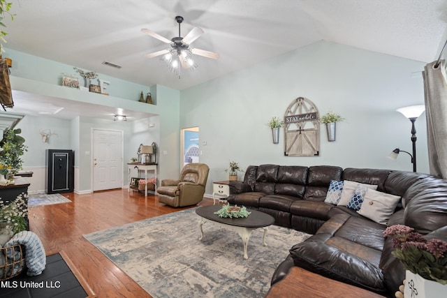 9884 Victor Dr, Olive Branch, MS 38654 - living area featuring a ceiling fan, wood finished floors, and vaulted ceiling