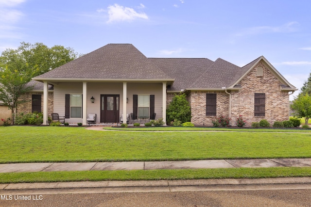 705 Brookwood Cir, Brandon, MS 39042 - view of front facade with a front yard, roof with shingles, and brick siding