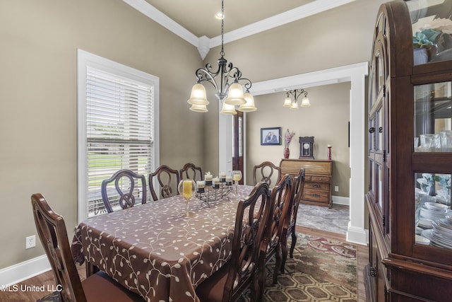 705 Brookwood Cir, Brandon, MS 39042 - dining area with wood finished floors, ornamental molding, a chandelier, and baseboards