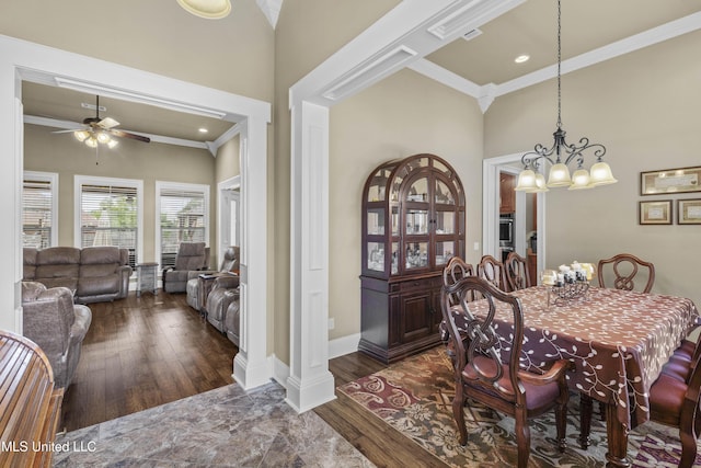 705 Brookwood Cir, Brandon, MS 39042 - dining room with crown molding, ceiling fan, wood finished floors, a chandelier, and a towering ceiling