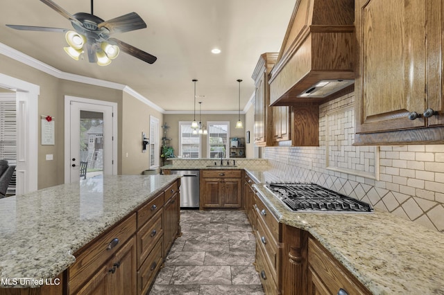 705 Brookwood Cir, Brandon, MS 39042 - kitchen with stainless steel appliances, custom range hood, a ceiling fan, decorative backsplash, and light stone counters
