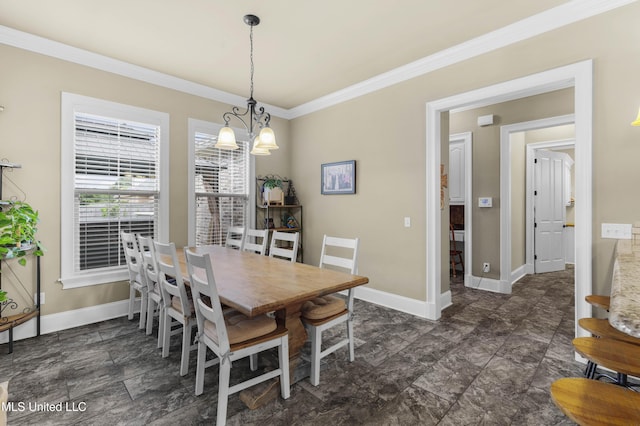 705 Brookwood Cir, Brandon, MS 39042 - dining room featuring ornamental molding, baseboards, a chandelier, and stone finish floors
