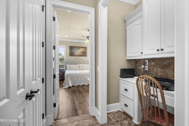 705 Brookwood Cir, Brandon, MS 39042 - home office with ceiling fan, crown molding, and baseboards