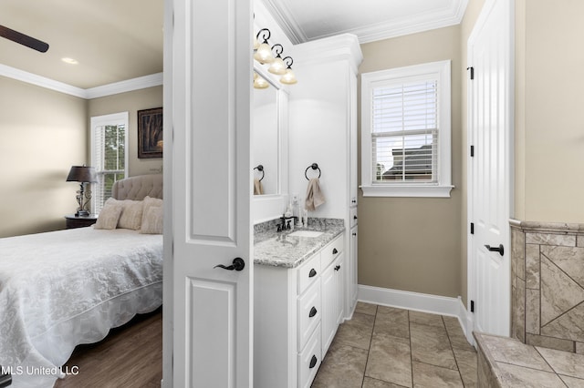 705 Brookwood Cir, Brandon, MS 39042 - ensuite bathroom with vanity, crown molding, baseboards, and a ceiling fan