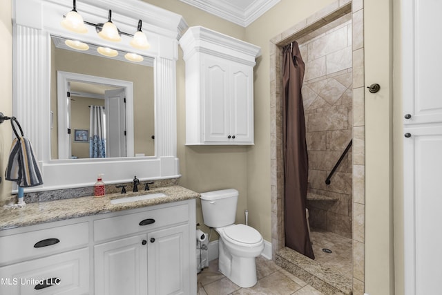 705 Brookwood Cir, Brandon, MS 39042 - bathroom featuring vanity, toilet, a tile shower, ornamental molding, and baseboards