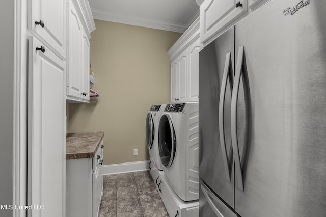 705 Brookwood Cir, Brandon, MS 39042 - washroom with separate washer and dryer, cabinet space, crown molding, and baseboards