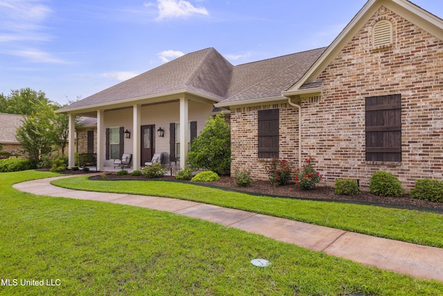 705 Brookwood Cir, Brandon, MS 39042 - view of front of property with a front lawn, a shingled roof, brick siding, and covered porch