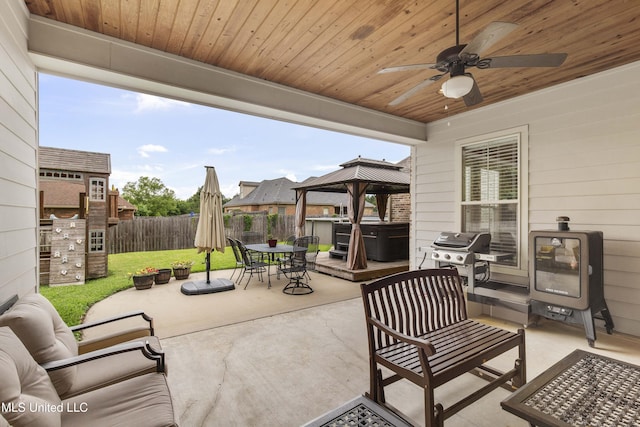 705 Brookwood Cir, Brandon, MS 39042 - view of patio / terrace featuring outdoor dining space, a grill, ceiling fan, a hot tub, and a gazebo