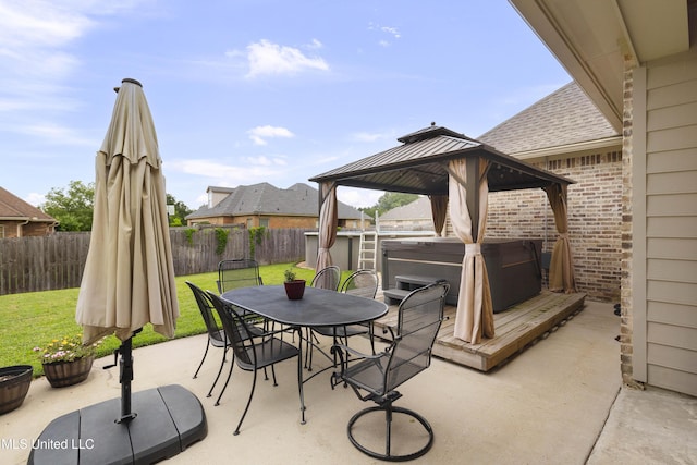705 Brookwood Cir, Brandon, MS 39042 - view of patio with a hot tub, a gazebo, and outdoor dining space