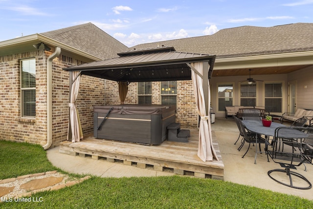 705 Brookwood Cir, Brandon, MS 39042 - rear view of house with a hot tub, a gazebo, a ceiling fan, a deck, and a shingled roof